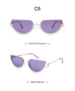 Detail of purple Y2K cat-eye sunglasses with gold metal frame and double ring hinge C5