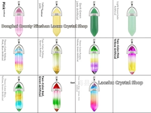 Macro display of eleven colorful synthetic crystal hexagonal pillar pendants in a grid