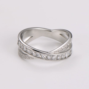 Detail of silver crisscross ring featuring micro-paved cubic zirconia stones for women