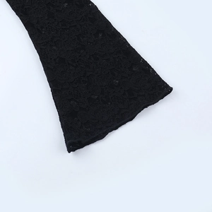Detail of elegant black sheer floral lace fabric and flared bell sleeve design