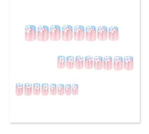 Close-up of 24pcs short square press-on nails with blue French tips and white flower patterns