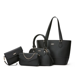 Black 4-piece tote bag set in Saffiano faux leather with gold hardware on white background