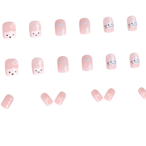 Pink press-on nails with cute panda, cat, and bow graffiti art on a white background