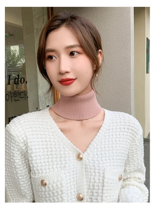 Detail of pink knit turtleneck dickey collar featuring a soft vertical ribbed texture