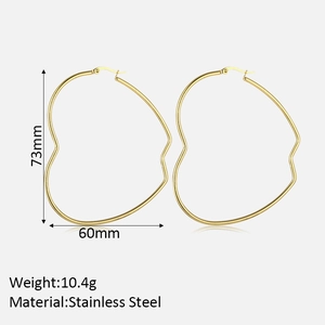 Detail view of large gold heart hoop earrings showing 73mm height and 10.4g weight