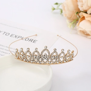 Elegant gold bridal crown featuring sparkling rhinestones for wedding hair accessories