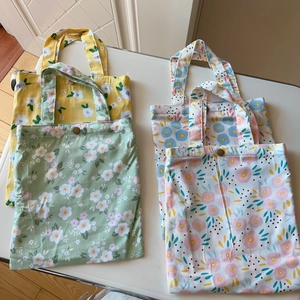 Vertical floral cotton tote bags with vintage metal buckles in four assorted patterns