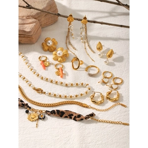 Collection of 18k gold-plated twisted earrings, pearl necklaces, and floral studs set