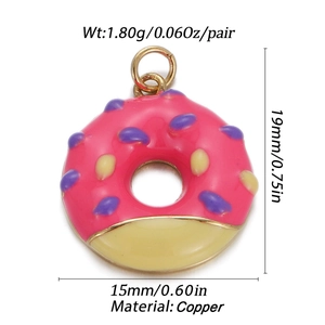 Detail view of pink enamel donut pendant with gold plating and copper dimensions