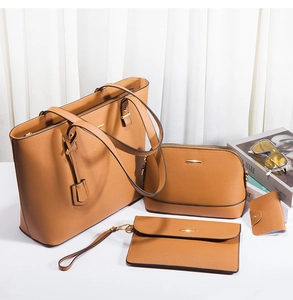 Brown four-piece handbag set including tote and clutch bags with gold hardware