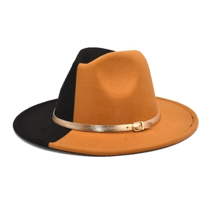 Detail of two-tone wool fedora featuring gold leather band and metallic buckle accent
