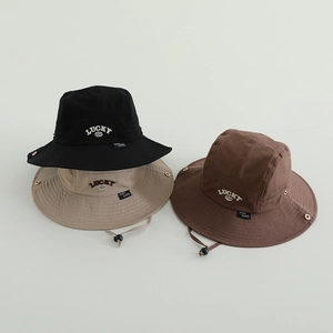 Detailed view of three cotton bucket hats with LUCKY embroidery and adjustable wind strings