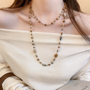 Close-up of double-layer beaded necklace with natural tiger eye and earth tone stones