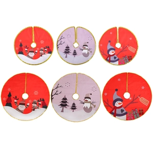 Christmas tree skirt with gold trim and Santa print in red and purple festive patterns