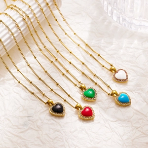 Detail of colorful enamel heart pendants with white rhinestones on golden bead chains