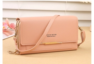 Pink multi-functional phone bag with lychee texture, double zippers, and a gold metal bar