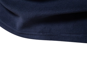 Close-up of navy blue fleece fabric showing high-quality double-stitched hem texture