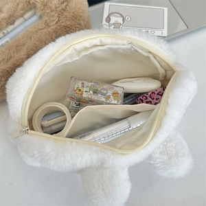 Internal view of the plush white rabbit stationery bag with pockets and zipper