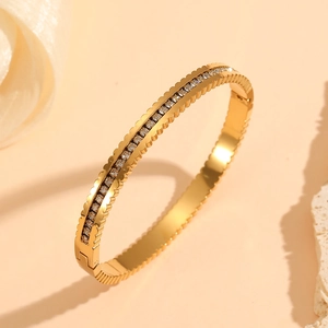 18k gold plated stainless steel geometric bangle with diamonds in a 45-degree view