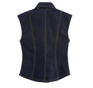 Detail view of the back of a dark blue denim vest with yellow contrast stitching accents