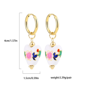 Detailed view of floral heart pendant hoop earrings with height and width measurements