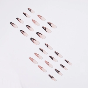 Press on nails with long coffin shape featuring black flame and leopard patterns