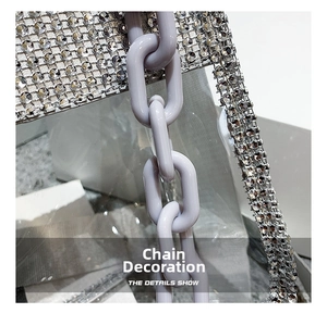 Detail of transparent PVC bag featuring lavender chain and sparkling silver rhinestones