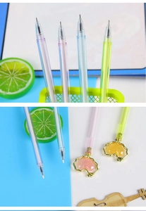 Detail of macaron gel pens with metallic heart pendants and fine needle tip nibs