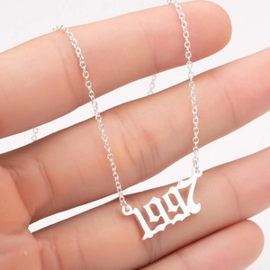 Silver stainless steel 1997 birth year number pendant necklace held in hand