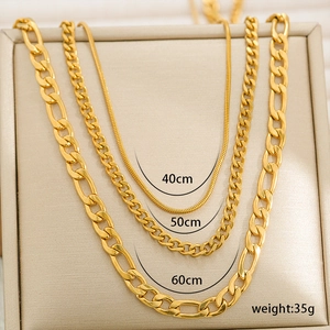 Three-piece layered gold Figaro, snake, and curb chain necklace set for women