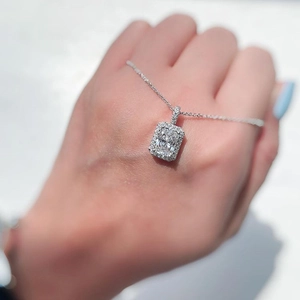 Elegant silver necklace with a large rectangular zircon pendant in a halo diamond setting