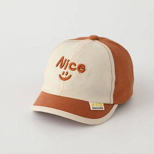 Close-up of contrast stitching on toddler baseball cap with Nice smiley embroidery