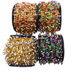 Assorted colorful metallic bead chains on spools for Christmas tree and bulb decoration