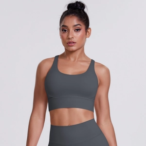 Detailed front view of dark gray yoga sports bra with wide straps and elastic hem
