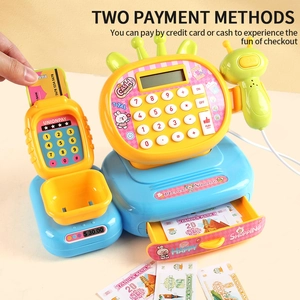 Detail of toy cash register with scanner, coins, play money, and POS card reader terminal