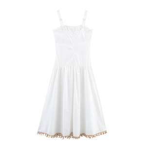 White beach vacation maxi dress with shell chain straps and tassel hem detail
