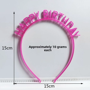 Close-up of pink plastic Happy Birthday headband with 15cm measurement scale