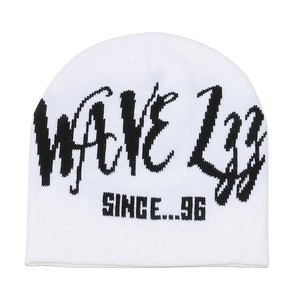 Close-up of white knit beanie featuring black WAVE 133 jacquard text and ribbed texture