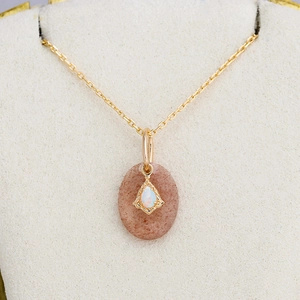 Elegant 925 silver gold-plated necklace featuring oval strawberry quartz and opal pendant