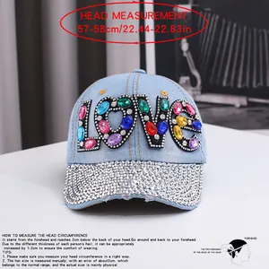 Detail of denim baseball cap with LOVE rhinestone and head measurement guide