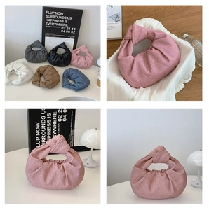 Detailed close-up showing the soft textured fabric and knot handle design of the bag