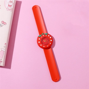 Detailed view of children's slap watch featuring a cute red strawberry silicone design