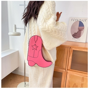 Pink western boot shaped shoulder bag with star embroidery and silver chain strap
