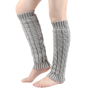 Detail of grey cable knit leg warmers showing the textured weave and warm material