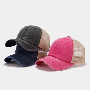 Three vintage mesh trucker hats in charcoal, navy, and pink with washed cotton fabric