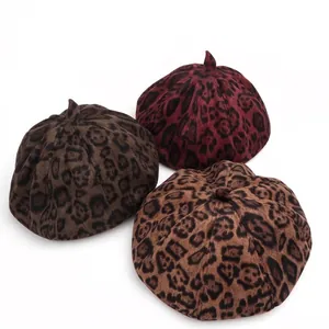 Three stylish suede leopard print pumpkin berets in brown, red, and beige colors