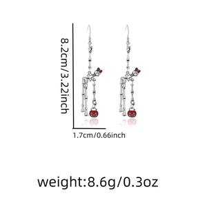 Detailed dimensions of silver skeleton earrings with red pumpkin charms for Halloween