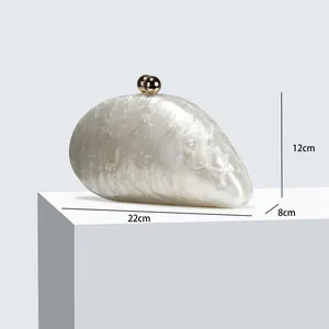 Detail showing acrylic evening clutch bag dimensions: length 22cm, width 8cm, height 12cm.