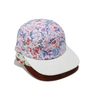 Floral print camper hat with flat brim featuring a romantic pink and blue flower pattern