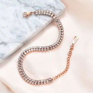 Detail of 6mm double-row crystal bracelet in 18K rose gold plating over marble and silk